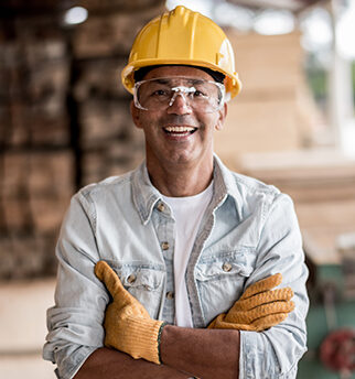 Carpenter wearing protective workwear at his workspace
